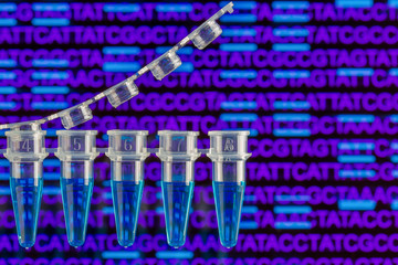 PCR tubes with nucleic acid sequence and bands in the background