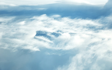 clouds view from the window of an airplane flying in the clouds