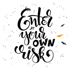 Obraz premium vector hand lettering halloween greetings text - enter at your own risk with bat