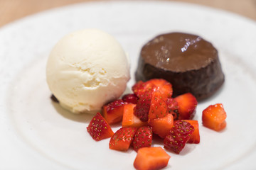 Chocolate lava cake with ice cream .
