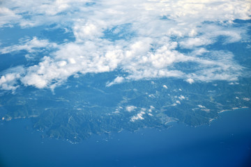 clouds view and City of Japan from the window of an airplane fly