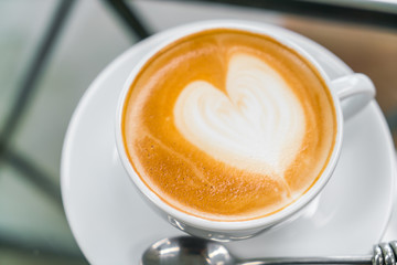 Latte Coffee art on the table .