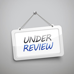 under review hanging sign