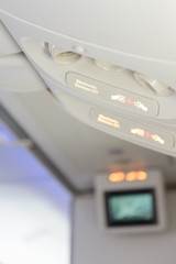Electronic devices off and fasten seat belt sign inside airplane