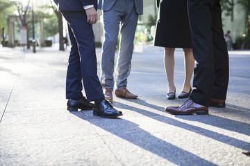 Feet of the four men of business people