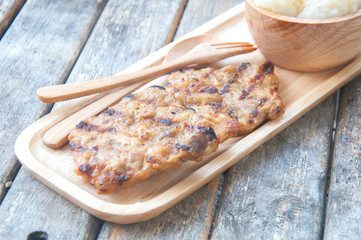 Thai Traditional Food,Grill pork with sticky rice on wood table