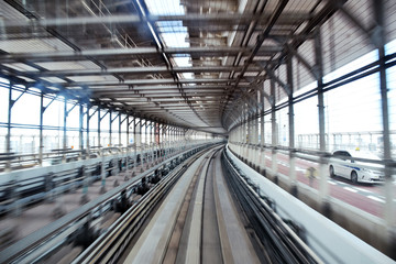 Picture inside a commuter train in Tokyo aproaching the end of Odaiba's Rainbow bridge.