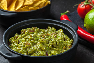 Bowl of guacamole with corn chips