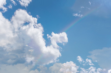 Naklejka na ściany i meble Beautiful a bright rainbow in the blue sky,Cloud same a dragon and beautiful rainbow in the blue sky