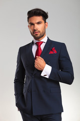 elegant business man in double breasted suit looking up