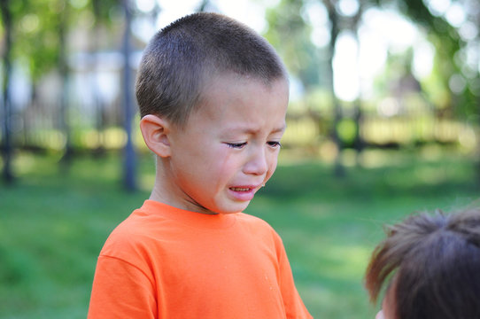 little boy crying with tears outdoor