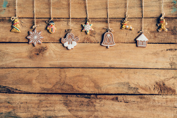 Christmas decoration hanging on wood background texture with cop