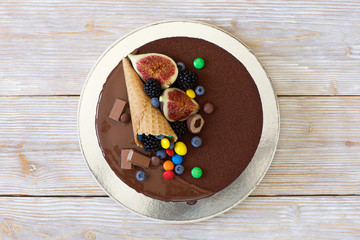 Child chocolate cake with colorful candy
