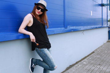 hipster girl at the blue wall