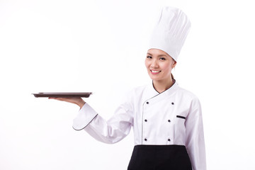 happy, smiling, positive female chef pointing up blank food tray