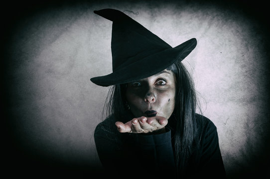 Halloween witch. Low key. Computer added dirt, scratches, grain and vignette.