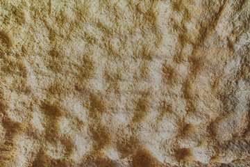 Textured limestone rock with erosion waves surface