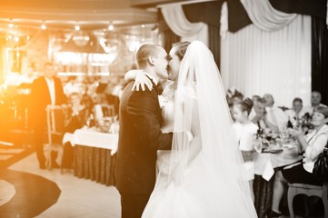 Amazing first wedding dance of stylish wedding couple at luxury restaurant