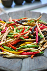 Traditional colorful Italian dried homemade pasta fusilli with eight colors