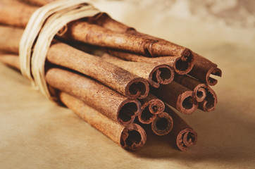 cinnamon sticks on paper bakcground horizontal