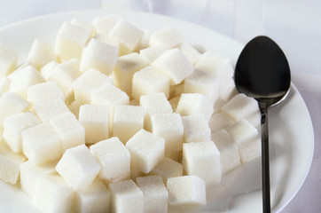 sugar cubes in a plate horizontal close-up