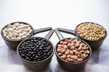 Beans variety/ different types of beans on black wooden background