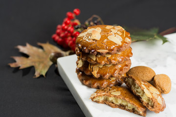 Typical Dutch filled spicy  cookies with almonds on autumn color