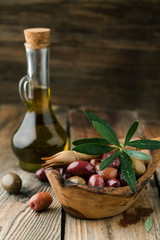 Olives in a bowl with spices oregano