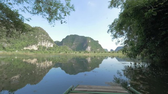 Picturesque seascape with limestone mountains, view from sailing boat. Nature tourism in Ha Long Bay, Vietnam