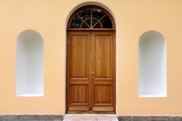 Classic style concept. Arched door with empty arcades on each side - piece of classical old building. Copy space.