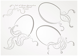 Set of three decorative oviform floral frames with leaves.