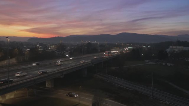 Aerial, City's freeway at sunset, sunrise
