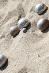 Playing of bocce in the sand