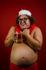 Funny naked Santa with beer. 