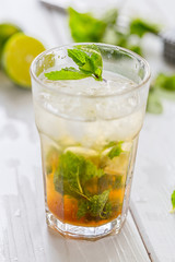 Fototapeta premium Mojito Cocktail and Ingredients on Light Table