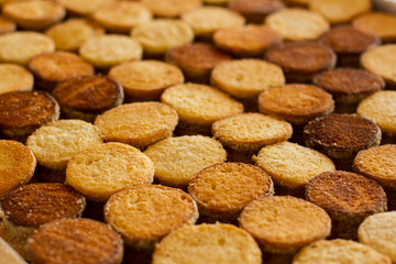 Rows of cookies. Brown and yellow biscuits. Production of desserts. Only top quality components.