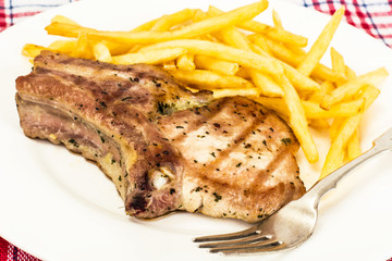 Loin Roast with Potatoes Fries on White