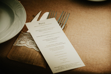 Wedding menu card over table setting. Event detail.  - 120453258