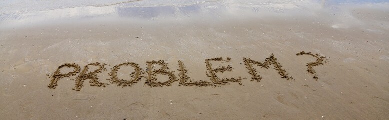 PROBLEM written on the beach sand