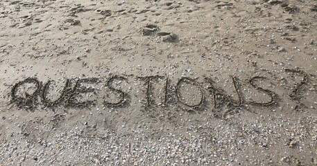 QUESTIONS written on the beach