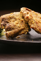 Pork ribs on a dark background