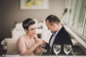 happy couple hugging in a restaurant