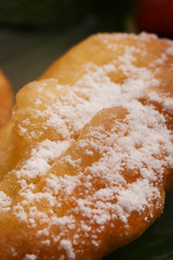 Close up image of fried banana with coconut flakes on the top