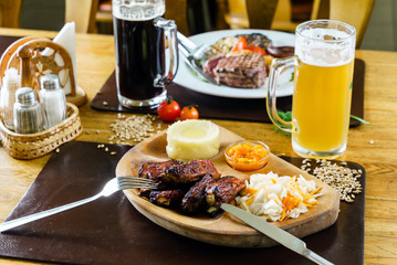 grilled ribs with salad and mashed potato