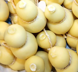 many forms of caciocavallo cheese sale in Italian market