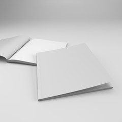 Opened and closed square format catalogs or magazines isolated