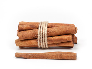Tied bunch of cinnamon sticks isolated on white background