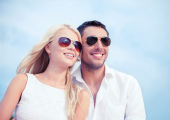 couple in shades at sea side