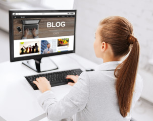 businesswoman with computer blogging at office
