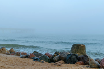 Fototapeta na wymiar Pier in the fog in Zelenogradsk on the Baltic sea